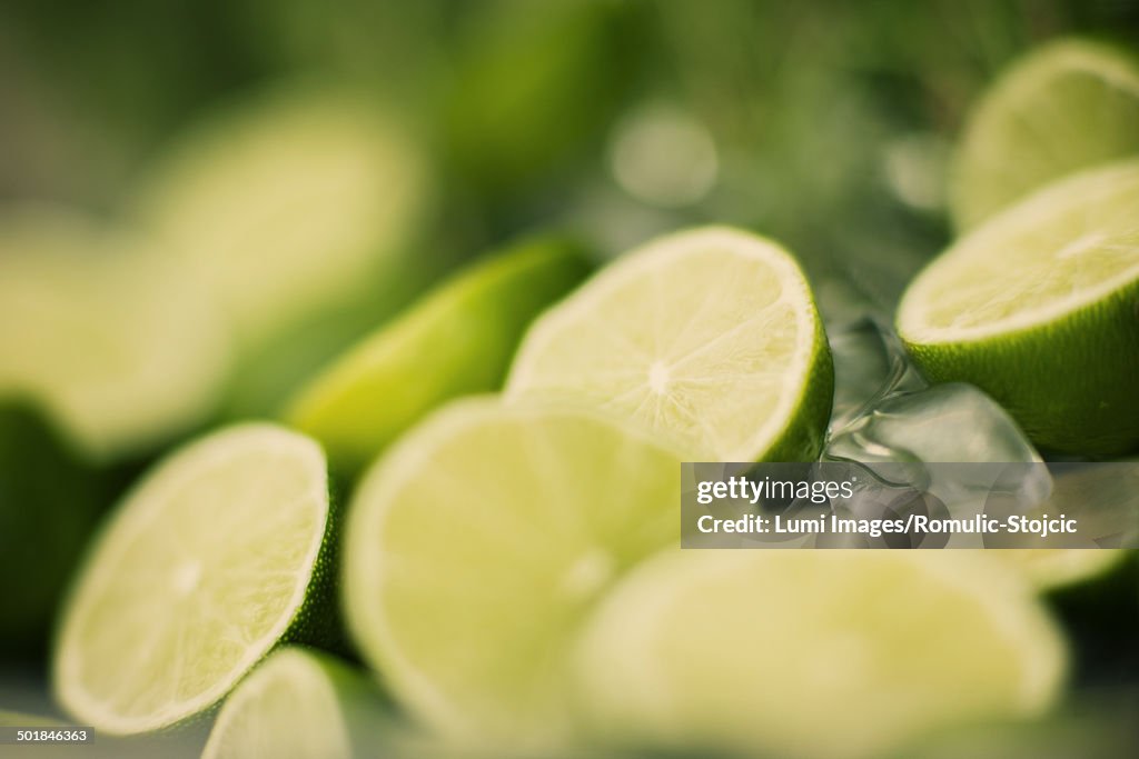 Fresh lime slices and ice cubes, close-up