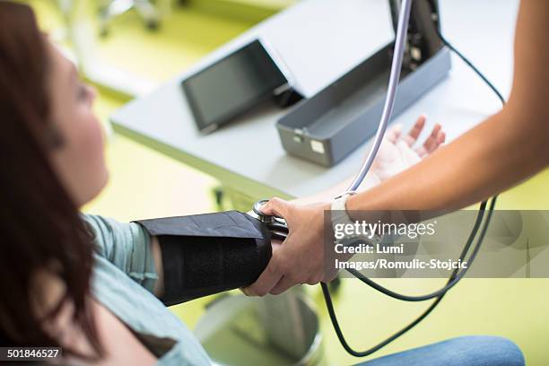 blood pressure testing - preventive care stock pictures, royalty-free photos & images