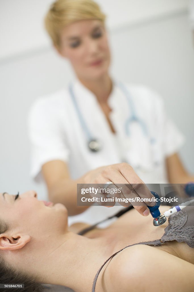 Female patient undergoing electrocardiogram, Munich, Bavaria, Germany