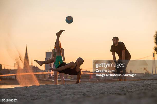 young people on the beach playing soccer, drava river, osijek, croatia - osijek - fotografias e filmes do acervo