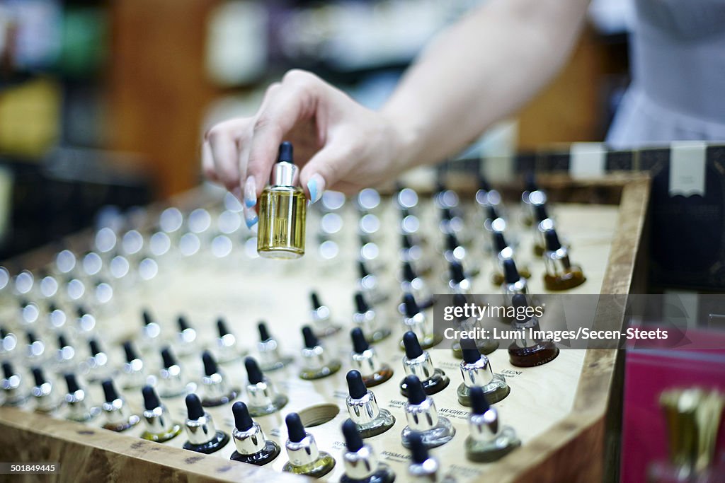 Person choosing a perfume in shop, Zagreb, Croatia, Europe