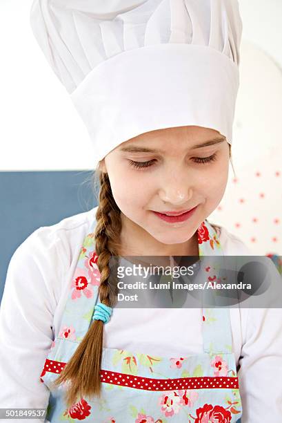 little girl with chef's hat, munich, bavaria, germany - alexandra dost stock-fotos und bilder