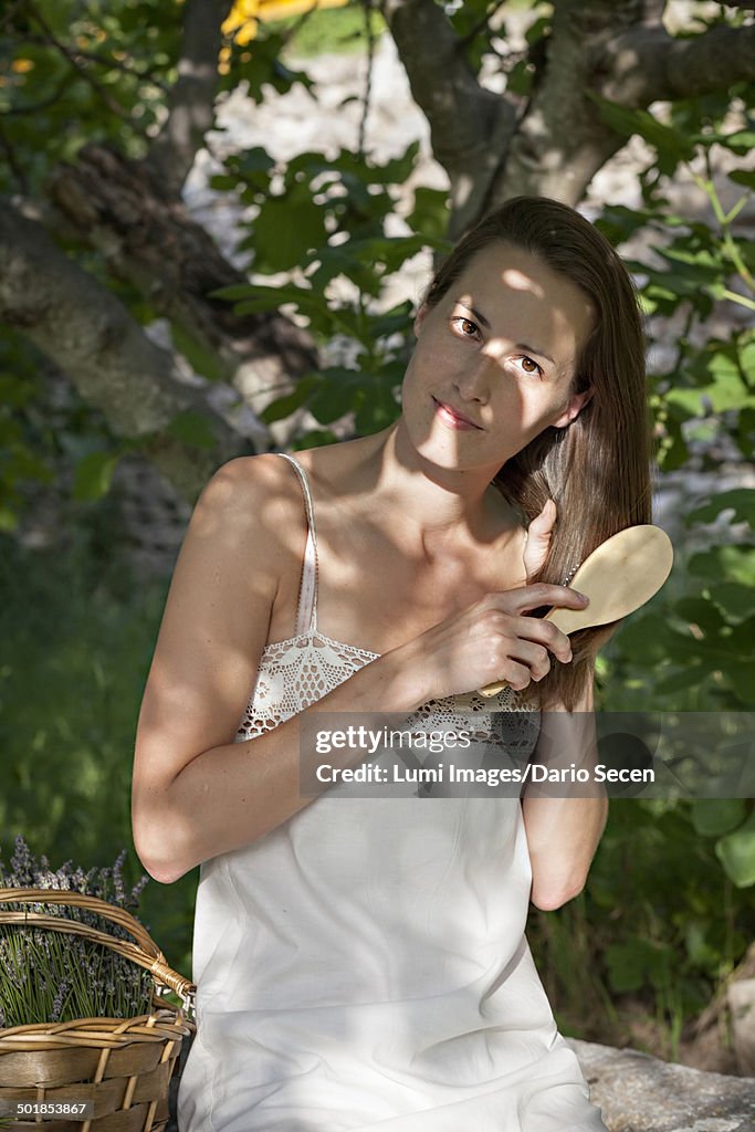 Woman Brushing Her Hair Outdoors, Croatia, Dalmatia, Europe