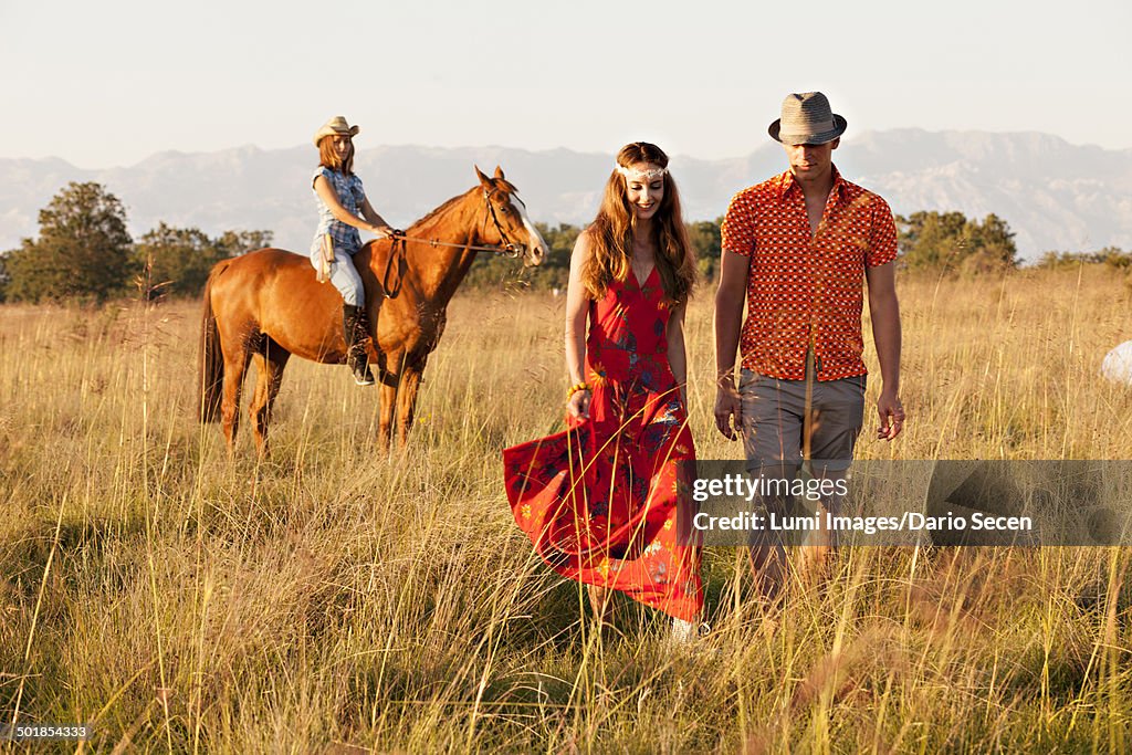 Croatia, Dalmatia, Young people with horse in the countryside