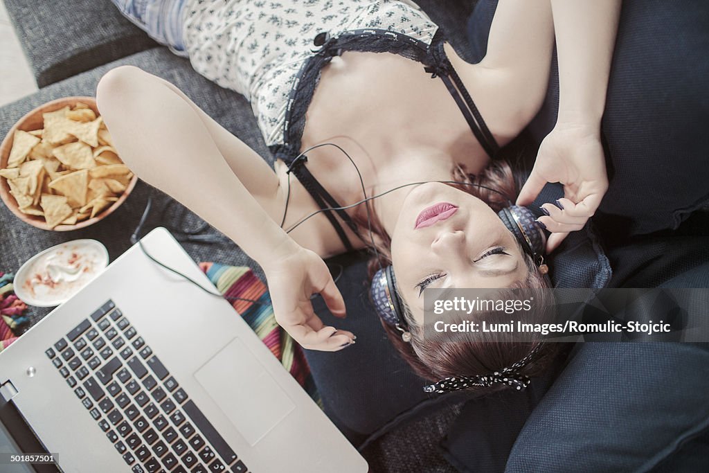 Young woman with headphones listening to music