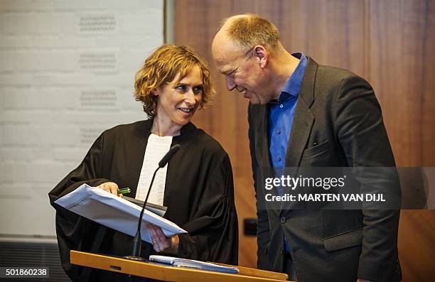 Lawyer Channa Samkalden and Friends of the Earth spokesman Geert Ritsema talk on December 18 in The Hague after the Dutch appeals court ruled that...