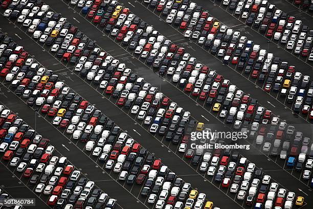 Rows of new automobiles sit parked at the Port of Bristol, operated by The Bristol Port Company, in this aerial photograph taken over Bristol, U.K.,...
