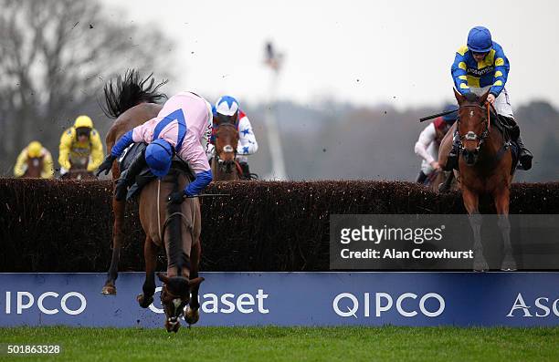 Harry Skelton riding Amore Alato is unseated at the last when in the lead in The Mitie Novices' Steeple Chase with eventual winner Sam Twiston-Davies...