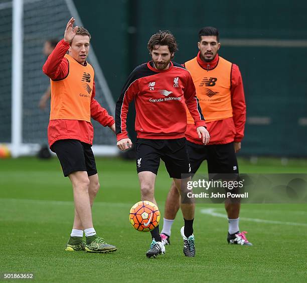 Joe Allen and Lucas Leiva of Liverpool in action during a training session at Melwood Training Ground on December 18, 2015 in Liverpool, England.