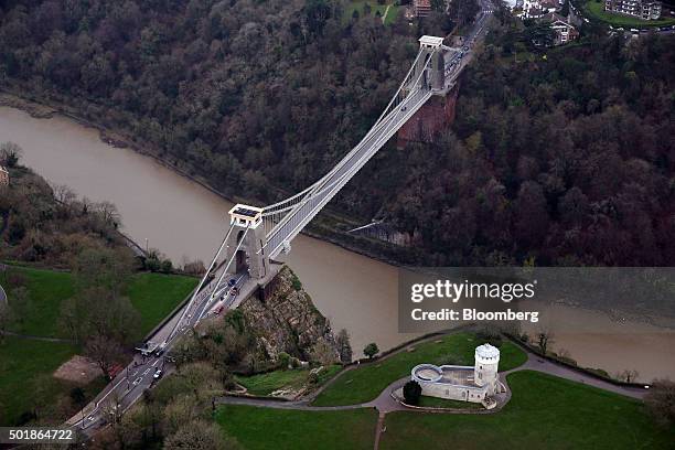 Traffic passes over the Clifton Suspension Bridge as it stands above the River Avon in this aerial photograph taken over Bristol, U.K., on Thursday,...