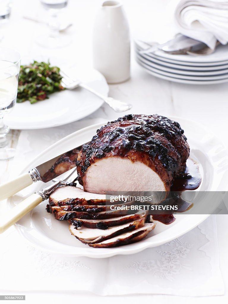 Still life of sliced cranberry glazed roast turkey