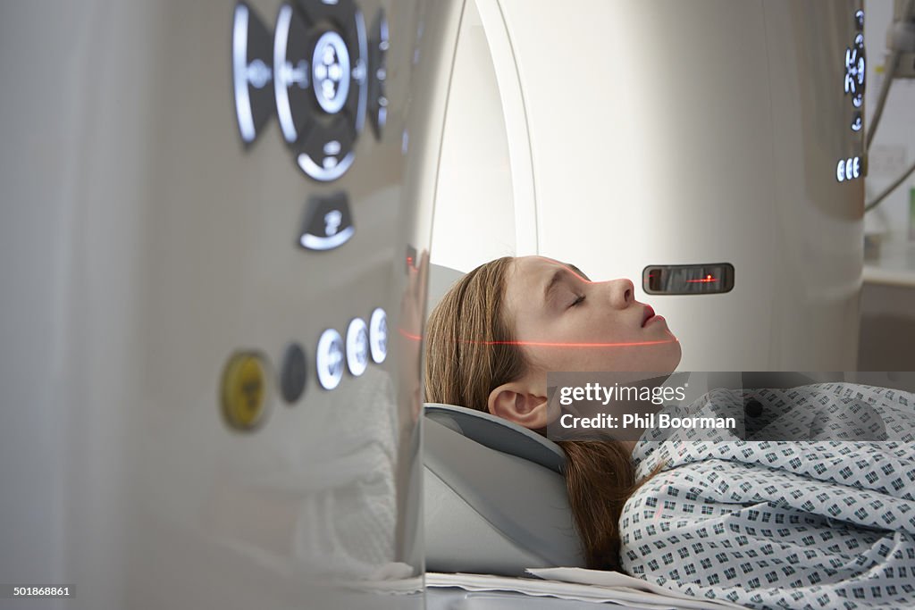 Girl going into CT scanner