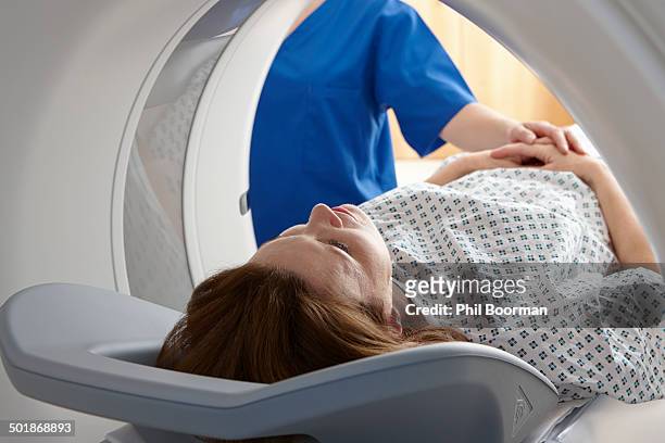 woman in ct scanner - computerized tomography stock pictures, royalty-free photos & images