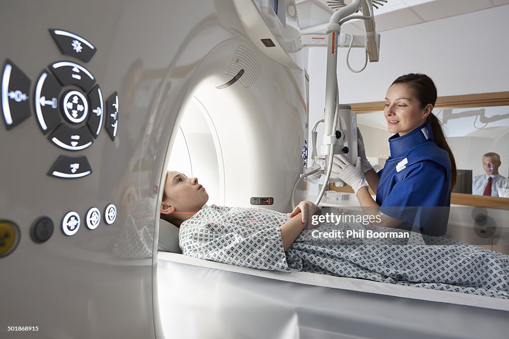 Girl going into CT scanner