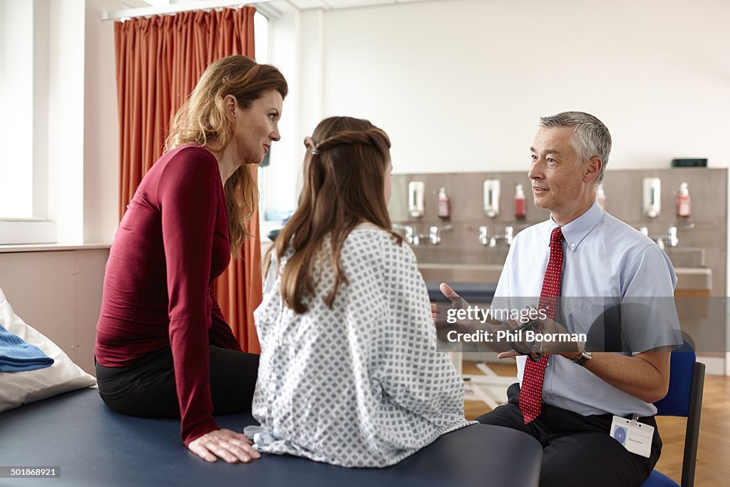 Doctor talking to patient and mother