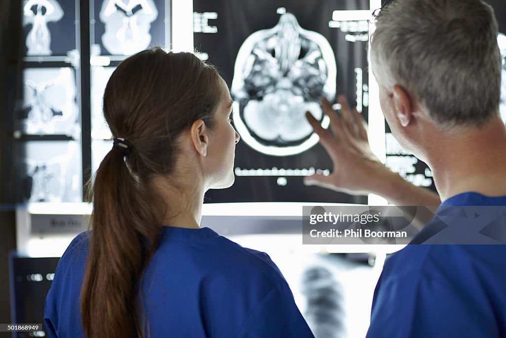 Radiologists looking at brain scans