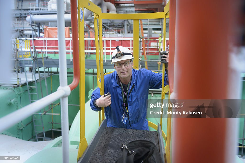 Electrical engineer inspecting cables during power station outage, portrait