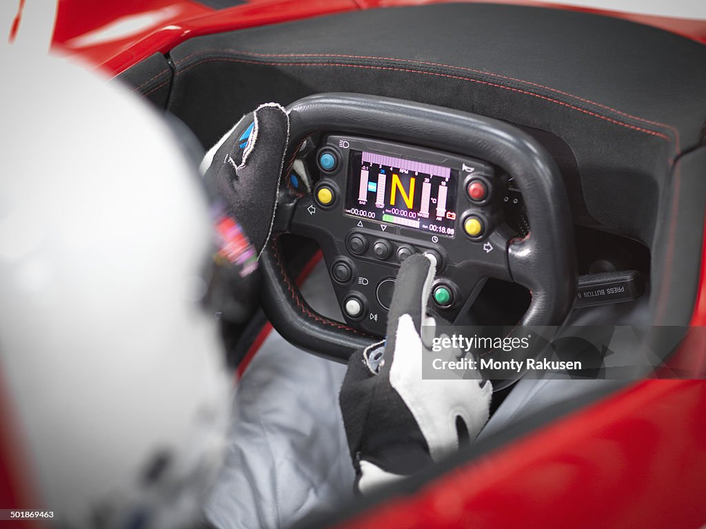 Close up of driver in supercar cockpit