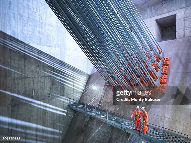 civil engineers inspecting cable anchorage in suspension bridge. the humber bridge, uk, built in 1981 was the world's largest single-span suspension bridge - humber bridge stock pictures, royalty-free photos & images