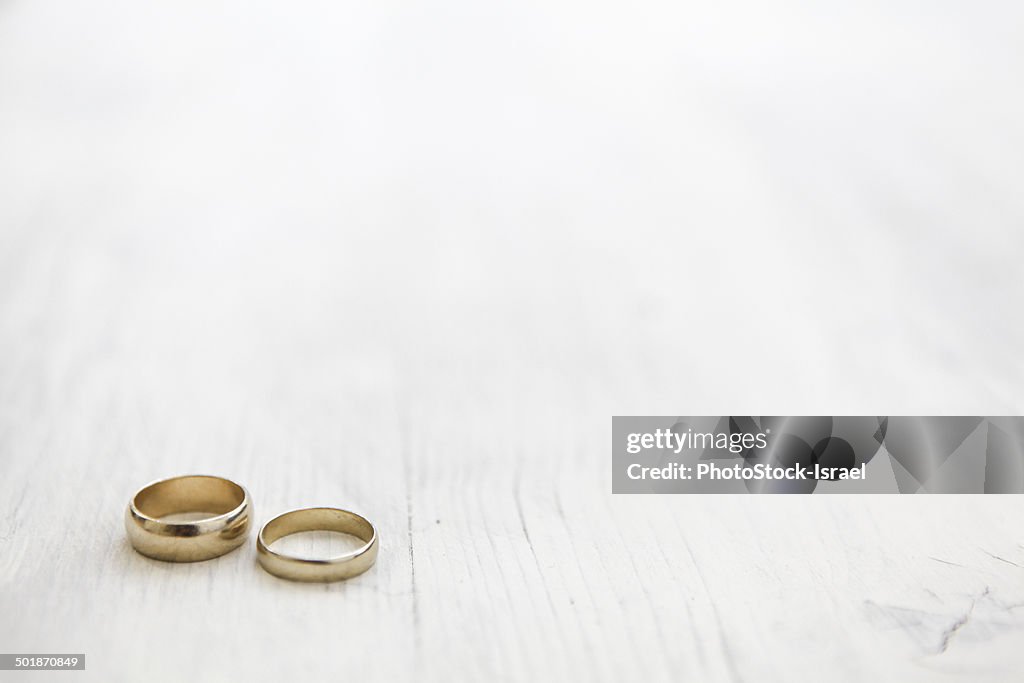 Still life of his and hers wedding rings