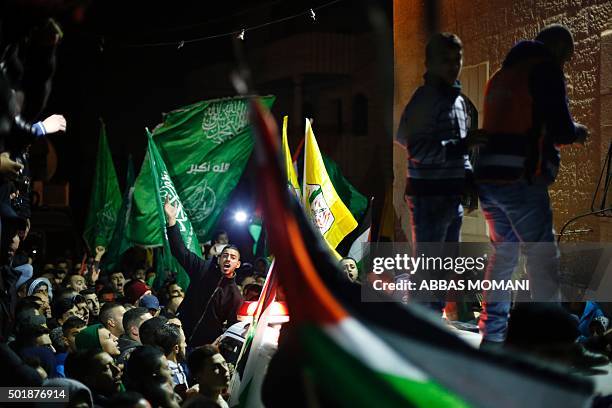 Palestinians chant slogans during the funeral of 14-year-old Hadeel Awwad, who was shot dead on November 23 by an Israeli police officer following a...