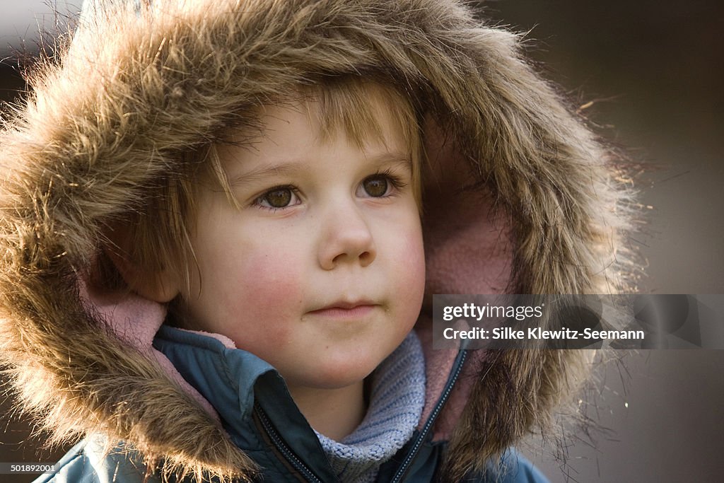 Girl, 3, wearing a hood, portrait, Crailsheim, Hohenlohe, Baden-Wurttemberg, Germany