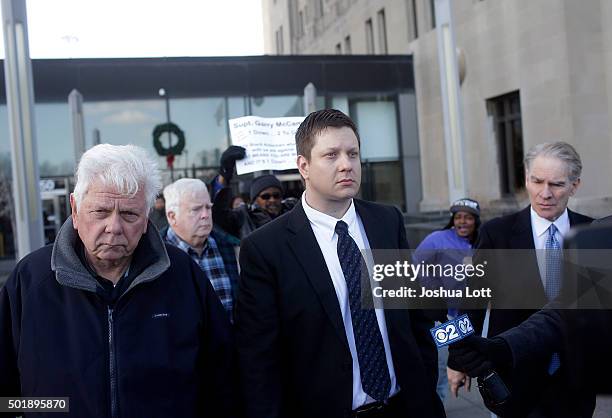 Former Chicago police officer Jason Van Dyke, center, who was charged with murder last month in the shooting death of Laquan McDonald leaves the Cook...