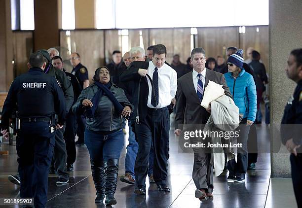 Former Chicago police officer Jason Van Dyke, center, who was charged with murder last month in the shooting death of Laquan McDonald arrives at the...