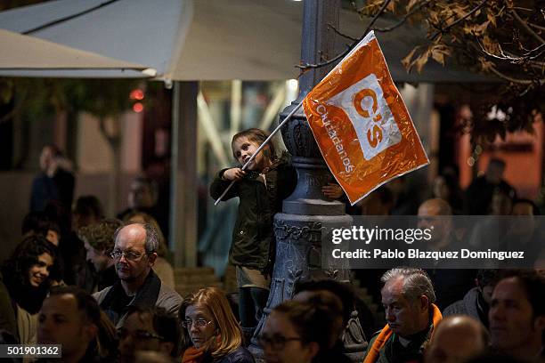 Girl bites a flag of Ciudadanos party during the final electoral campaign rally at Plaza de Santa Ana on December 18, 2015 in Madrid, Spain. Over 36...