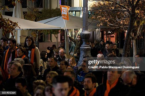 Girl waves a flag of Ciudadanos party amid other supporters during the final electoral campaign rally at Plaza de Santa Ana on December 18, 2015 in...