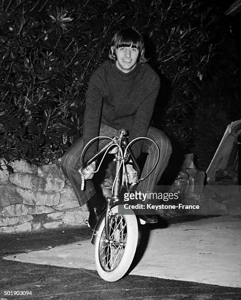Ringo Starr at home on his folding mini bike in Weybridge, United Kingdom, circa 1960.
