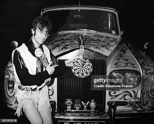 John Lennon with a psychedelic Rolls Royce in the United Kingdom, circa 1960.