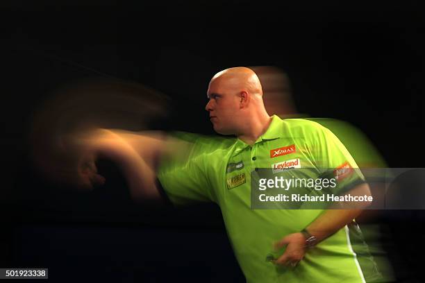 Michael van Gerwen in action during his first round match against Rene Eidams on day two of the 2016 William Hill PDC World Darts Championships at...