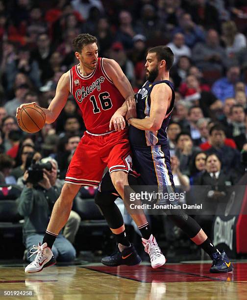 Pau Gasol of the Chicago Bulls moves against his brother Marc Gasol of the Memphis Grizzlies at the United Center on December 16, 2015 in Chicago,...