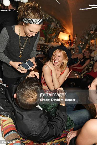 Cara Delevingne, Jonathan Saunders, Sienna Miller and Katie Grand attend the LOVE Christmas party at George on December 18, 2015 in London, England.