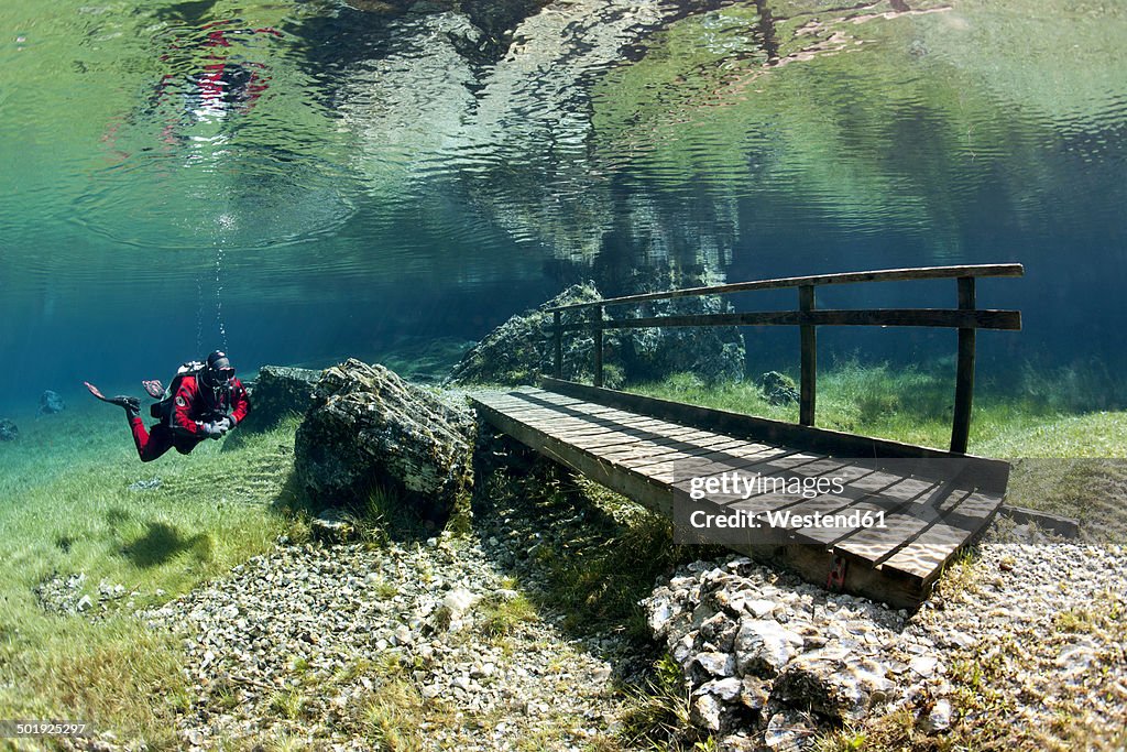 Austria, Styra, Tragoess, Green Lake, Diver and wooden boardwalk