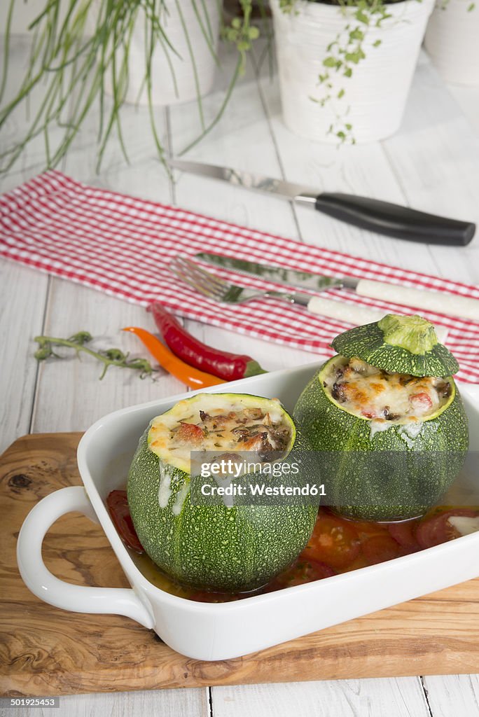 Baked filled eight ball squashes with ground beef in a gratin dish, Low Carb