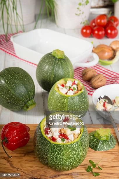 filled eight ball squashes and vegetables on table, low carb - stuffing photos et images de collection