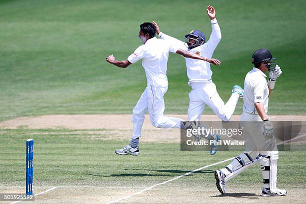 Dushmantha Chameera of Sri Lanka celebrates with Kusal Mendis his wicket of Ross Taylor of New Zealand during day two of the Second Test match...