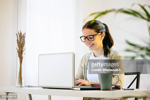 woman working at modern home office - desk woman glasses stock pictures, royalty-free photos & images