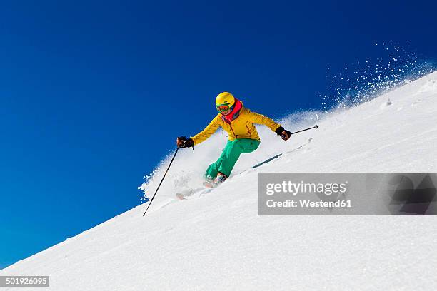 switzerland, graubuenden, obersaxen, female skier - esquí fotografías e imágenes de stock