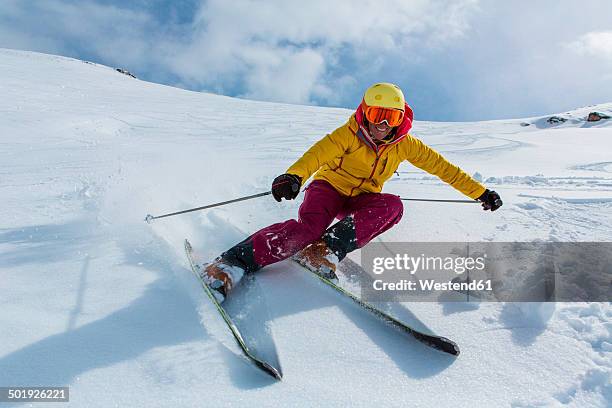 switzerland, graubuenden, obersaxen, female skier - skis stock pictures, royalty-free photos & images