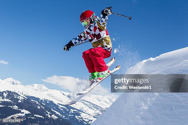 switzerland, grisons, obersaxen, boy on the slope - kid skiing stock pictures, royalty-free photos & images