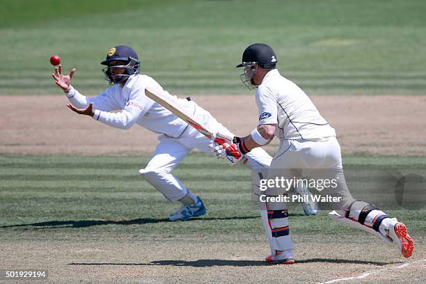 Brendon McCullum of New Zealand is caught out by Kusal Mendis of Sri Lanka during day two of the Second Test match between New Zealand and Sri Lanka...