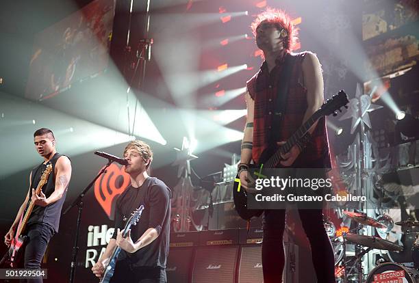 Luke Hemmings, Callum Hood and Michael Clifford of 5 Seconds of Summer performs onstage at Y100's Jingle Ball 2015 presented by Capital One at BB&T...