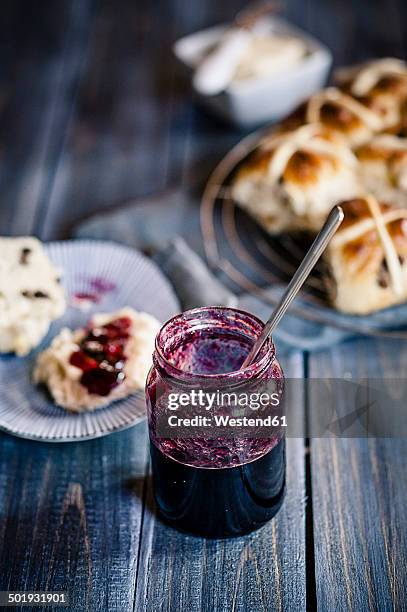 homemade currant jam and hot cross buns - hot cross bun stock pictures, royalty-free photos & images