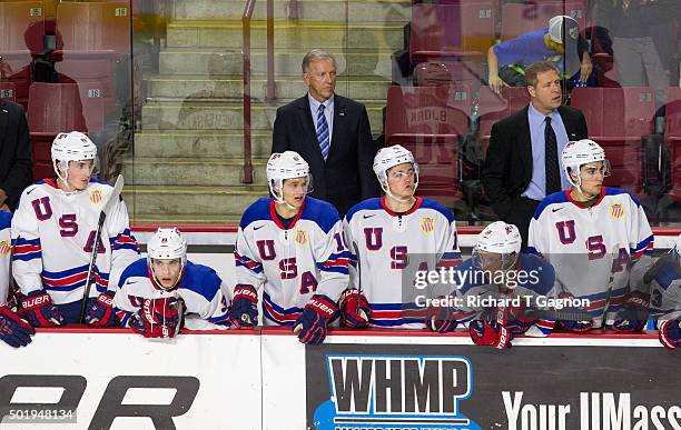 Ron Wilson head coach of the USA National Junior Team stands behind the bench during NCAA hockey action against the Massachusetts Minutemen at the...