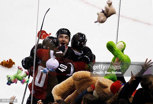 Ty Ronning of the Vancouver Giants celebrates his goal against the Everett Silvertips with teammates Josh Thrower and Trevor Cox during the first...