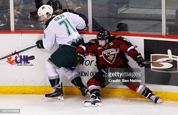 Ty Ronning of the Vancouver Giants is checked by Brandon Ralph of the Everett Silvertips during the second period of their WHL game at the Pacific...