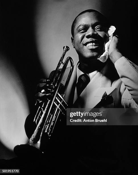 Jazz great Louis Armstrong with trumpet.